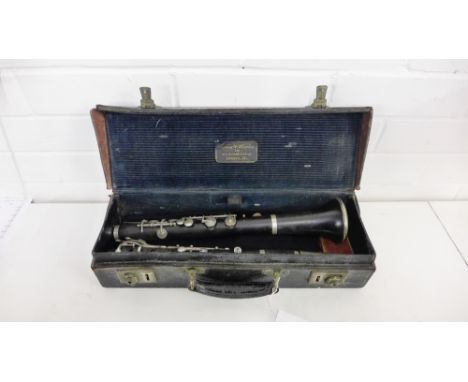 A Boosey and Hawkes Clarinet, with Serial No.32878, contained within leather Boosey and Hawkes box bearing label for 295 Rege