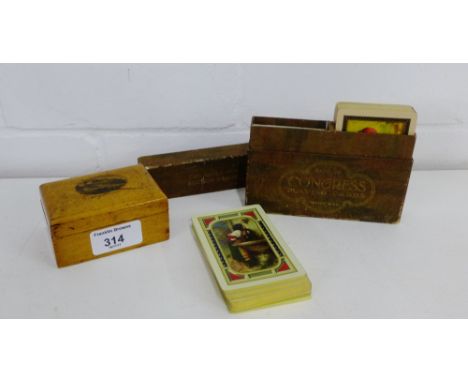 A Mauchline ware 'Edinburgh Castle' box and cover, together with an early 20th century two pack auction bridge congress playi