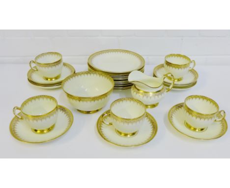 A Tuscan china teaset with gilt edged rims, comprising eight cups, twelve saucers, twelve side plates, sugar bowl and cream j