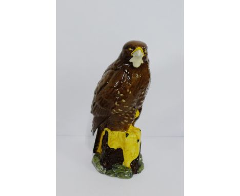 A Royal Doulton Series of Scottish Birds of Prey Whisky decanter, modelled in the form of a Buzzard, containing Whyte & Macka