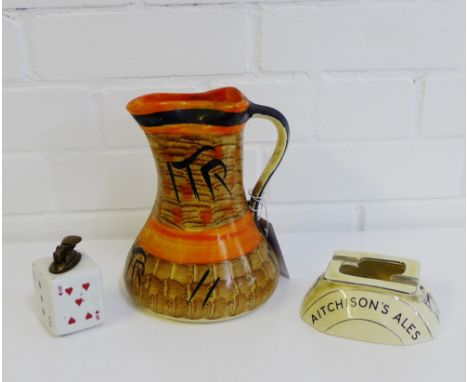 An Aitchison's Ales ashtray, together with a ceramic table lighter with playing cards pattern and a Myott Son & Co Art Deco j