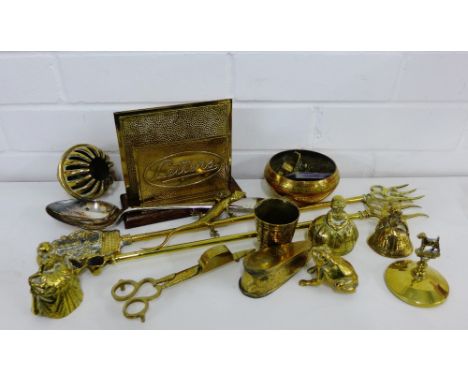 A quantity of brass wares to include a letter rack, toasting fork, bells etc., and an Epns serving spoon, (a lot) 