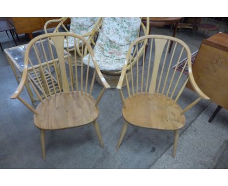 A pair of Ercol Blonde elm and beech 514 model Windsor cowhorn armchairs 