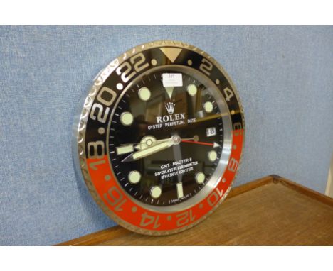 A Rolex style dealer's wall clock 