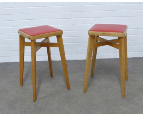 A pair of two  mid-century design stools by Benchairs, light oak with  red vinyl seats, 31 x 58cm. (2) 