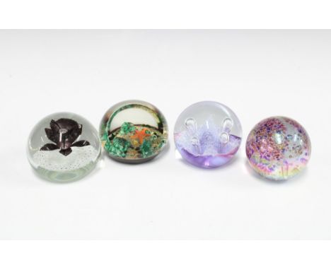 Four paperweights, including Caithness Moonflower and a Selkirk glass starfish paperweight (4) 
