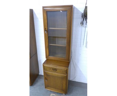 An Ercol Golden Dawn cabinet, 47 x 162 x 44cm. 