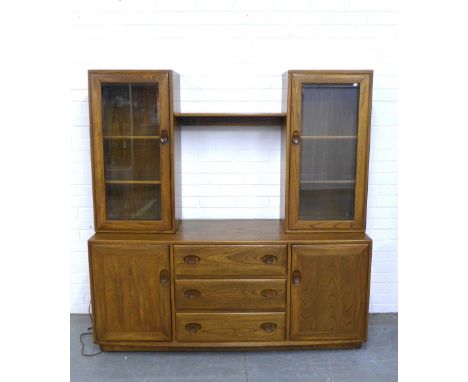 An Ercol Golden Dawn cabinet, 155 x 160 x 46cm. 