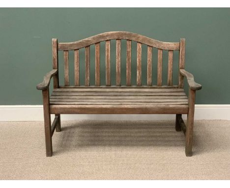 TEAK SLATTED GARDEN BENCH - having a shaped back and arms, 95cms H, 129cms W, 51cms D