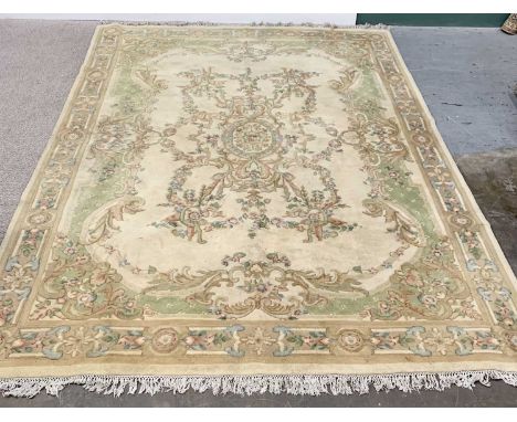 LARGE CHINESE WASHED WOOLLEN CARPET - cream ground having a standard single border, central panel and motif in multi-coloured