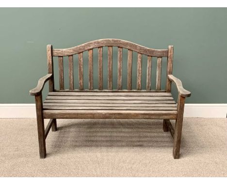 TEAK SLATTED GARDEN BENCH - having a shaped back and arms, 95cms H, 129cms W, 51cms D