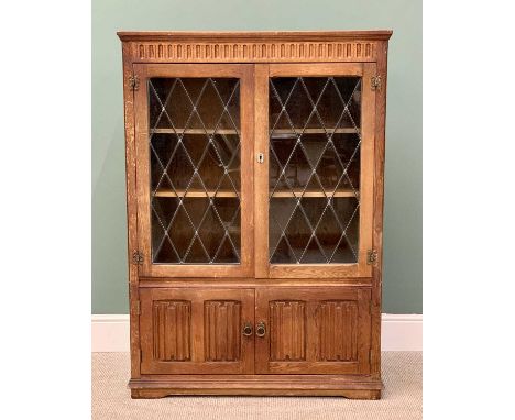 VINTAGE OAK BOOKCASE - Priory style having twin upper leaded lattice glazed doors and interior shelves, over twin lower cupbo