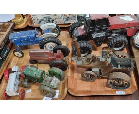 Collection of vintage tin plate and other tractors in playworn condition, one appearing to be a copper steam tractor.  (2)   