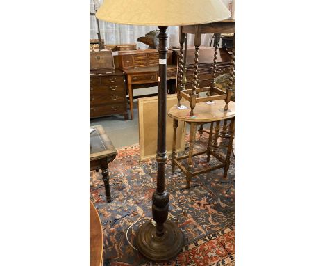 Modern hardwood standard lamp on circular base with shade.  (B.P. 21% + VAT) 