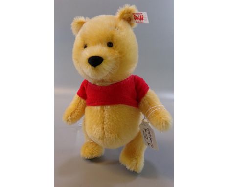 Modern Steiff Mini Winnie the Pooh blond teddy bear in original box.   (B.P. 21% + VAT) 