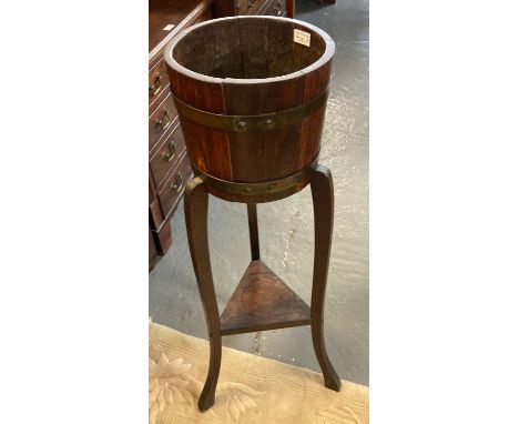 R A Lister &amp; Co, oak coopered jardinière on stand with metal mounts. (B.P. 21% + VAT)