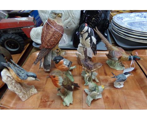 Tray of bird figures: Goebel West German pheasant, woodpecker, falcon, nuthatch, robin, wren, chaffinch, firecrest and white 