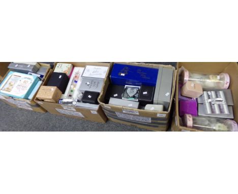 Four boxes of celebration items to include: Happy Birthday photo frames, various watches including Casio, Galileo thermometer