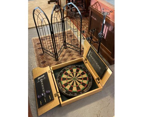 Harrows dartboard in fitted case with darts, together with three metal furnishing items, to include: folding fire screen and 