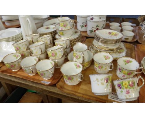Two trays of Royal Standard English bone china floral and gilt teaware to include: teacups and coffee cups, milk jugs, sugar 