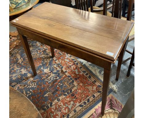 Late 18th/19th century mahogany fold over card table on tapering legs.  (B.P. 21% + VAT) 