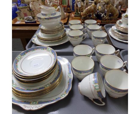 Two trays of Royal Albert 'Crown' china teaware, florally decorated, with a powder blue band and gilt edging: Twelve cups, sa