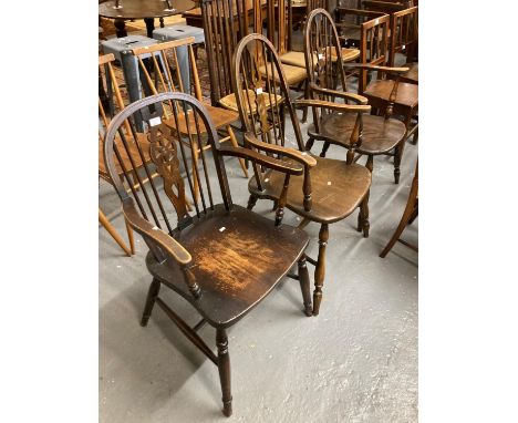 Pair of elm and beech hoop and stick wheel back armchairs, together with a similar armchair.  (3)  (B.P. 21% + VAT) 