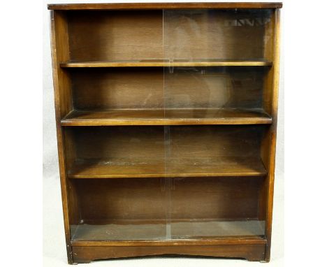 A vintage teak bookcase with sliding glass plate doors. H.113 W.91 D.24cm 