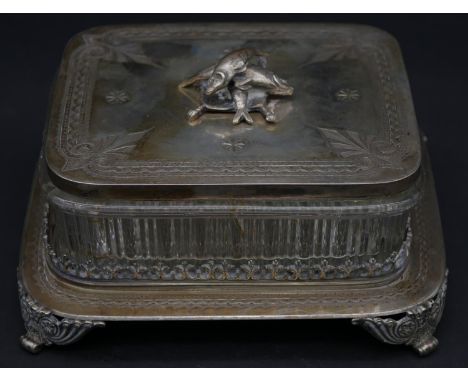 An antique silver plated engraved sardine dish with pressed glass liner. The lid is engraved with a stylised scrolling design