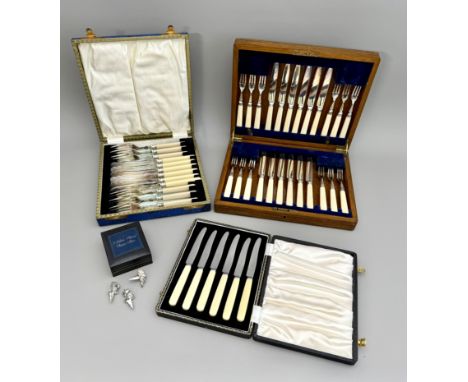 Three cased sets of silver plated flatware - including a 1920s oak cased set of 12 cake tea knives and forks; a cased set of 