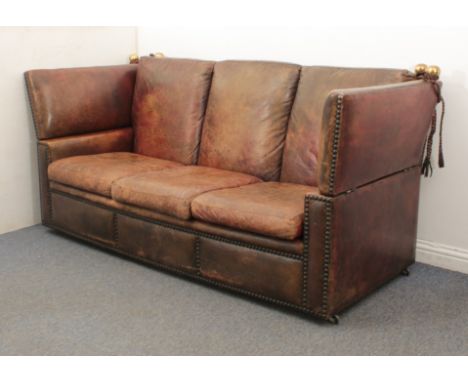 A large vintage brown leather Knowle sofa, probably by Maison Jansen of Paris - the aged, brass studded leather with an aged 