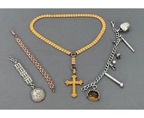 A small group of antique and vintage jewellery - including a silver fob chain with attached charms, propelling silver toothpi