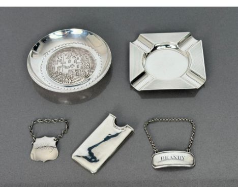 A heavy silver Art Deco style engine-turned ashtray by Mappin and Webb, hallmarked Sheffield 1954; a Victorian silver slip-ty