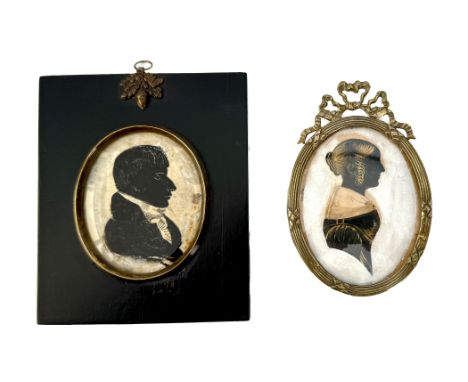 Two 19th century portrait silhouettes - comprising a silhouette miniature of a gentleman, oval, reverse painted on bevelled g