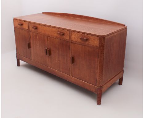 A good quality mid-century mid-oak sideboard - 1930s-40s, oak construction throughout, the top with short, arched upstand to 