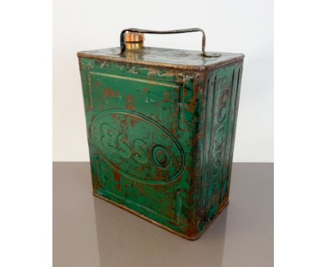 An early 20th century Esso petrol can - green painted over black (paint worn), with plain brass cap.