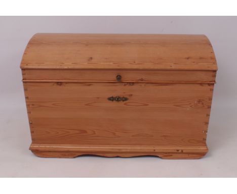 A Victorian-style waxed pine dome topped blanket box or trunk - the interior with till, carrying handles to sides. (LWH 103.5