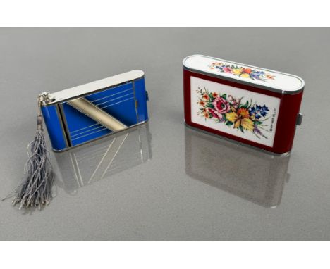 An Art Deco blue enamel powder compact in the form of a camera, with pull-out lipstick holder, mirror, original powder puff a