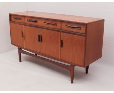 A G-Plan 'Fresco' teak sideboard - foil maker's label inside left hand cupboard, with three drawers (the centre drawer fitted