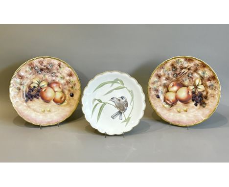 A pair of hand painted cabinet plates by the former Royal Worcester artist George Delaney - painted with a still life of frui