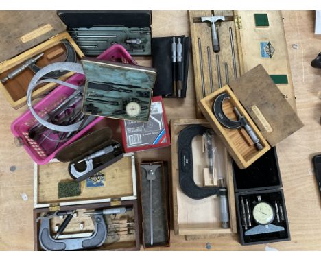 A collection of engineers precision tools including micrometers etc