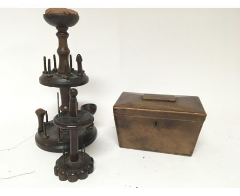 A 19th century treen bobbin holder and a 19th century tea caddy (2)