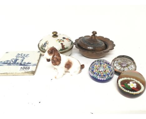 Three Millefiori quality glass paperweights a delft tile and a ceramic model of a red spaniel dog (a lot)