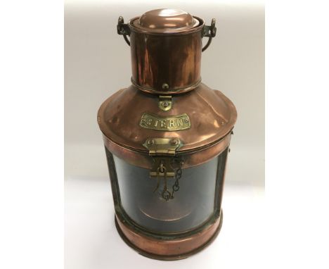A vintage copper ship's lamp.