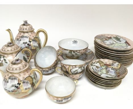 A Japanese eggshell tea set decorated with figures and applied gilt (a lot)  - NO RESERVE