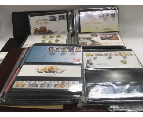 A box containing a collection of GB presentation packs and first day covers.