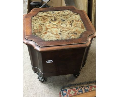 A mahogany commode on four wheels. No reserve.