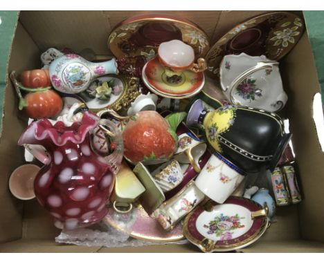 A box of glassware and ceramic items including a cranberry jug, crested ware bud vase of Southend etc.