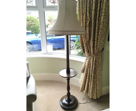 A stained beechwood standard lamp.