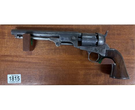 A Colt Model 1861 Navy cap &amp; ball .36-caliber revolver six-shot, single-action percussion revolver third model, with wall